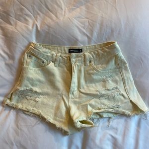 GLASSONS Mid rise light yellow jean cutoff shorts